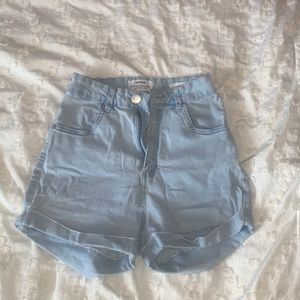 High waisted, stretchy jean shorts. Size 4